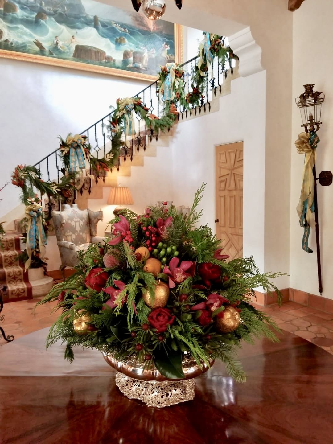 A table with flowers and ornaments in it