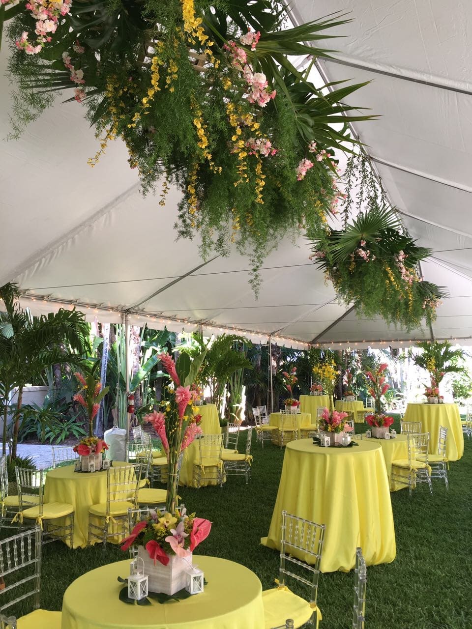 A tent with tables and chairs set up for an event.